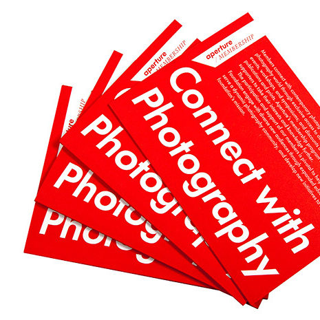 red aperture membership brochures in a fan with the words Conenct with Photography in large white letters